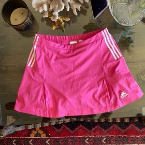 Adidas pink skirt dive small Shorts underneath.